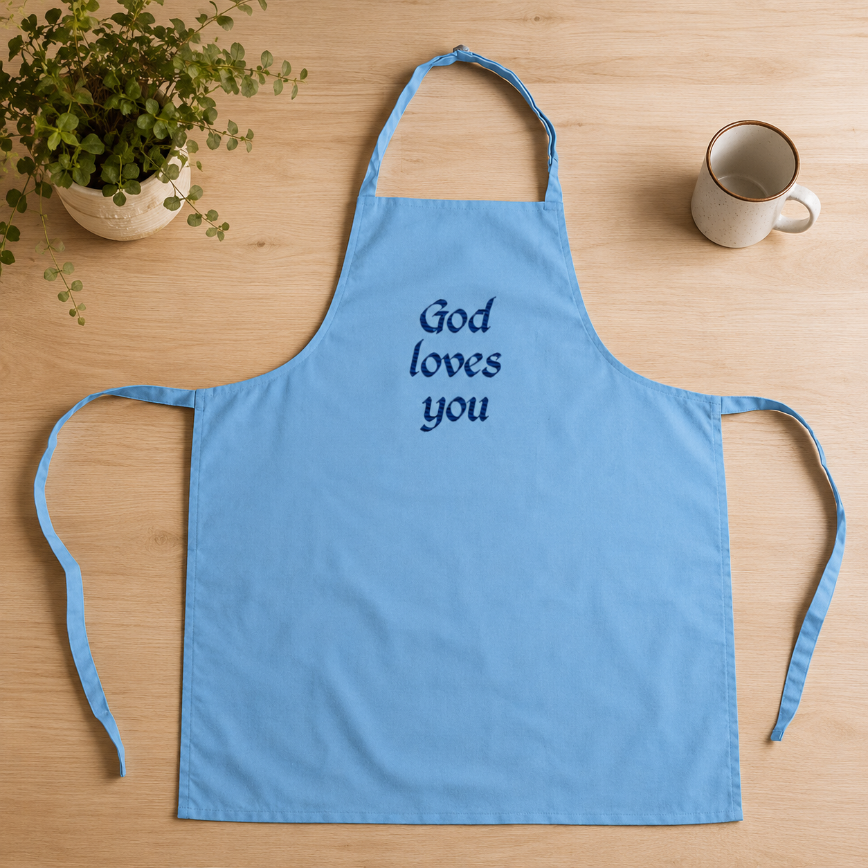 "God Loves You" Embroidered Apron — Sky Blue | Kingdom Wear UK